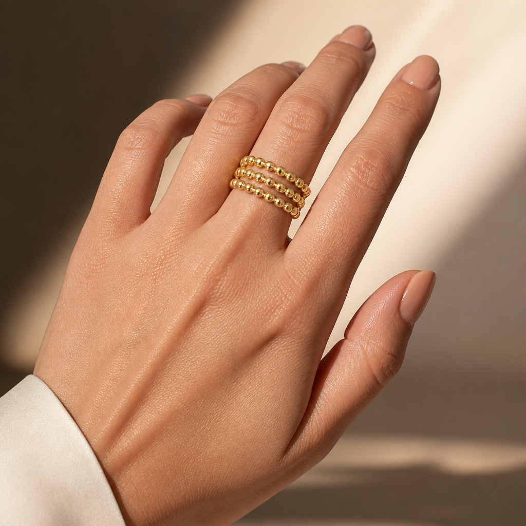 modern gold ring on a woman's hand